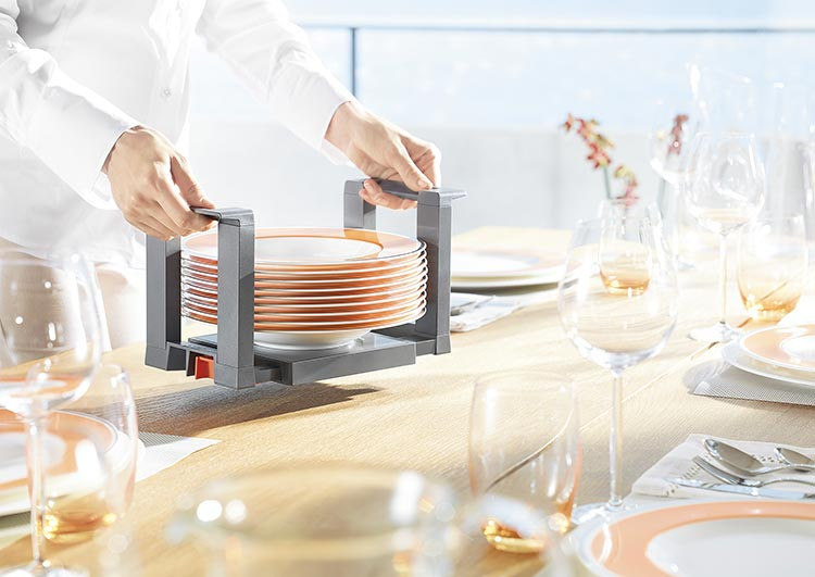 Blum ZC7T0350 Plate holder with plates being carried from drawer to table