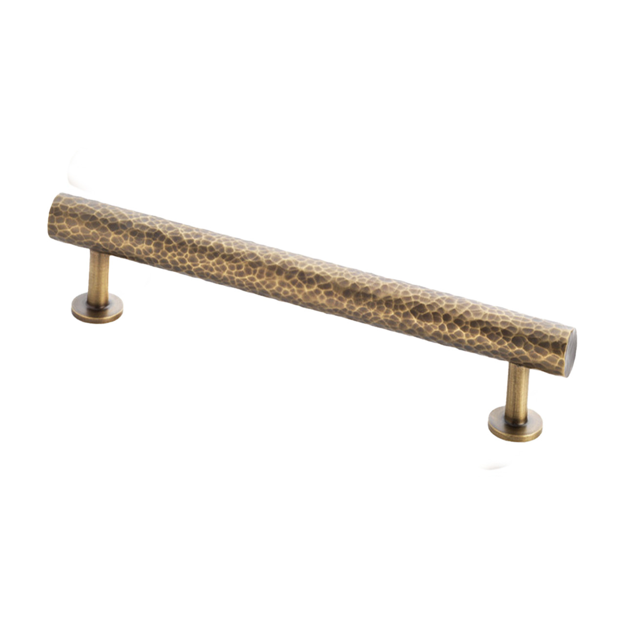 Crafted from solid brass, this handle features a distinctive hammered texture across the entire bar. Supported by two sturdy legs, each anchored with a circular rose.