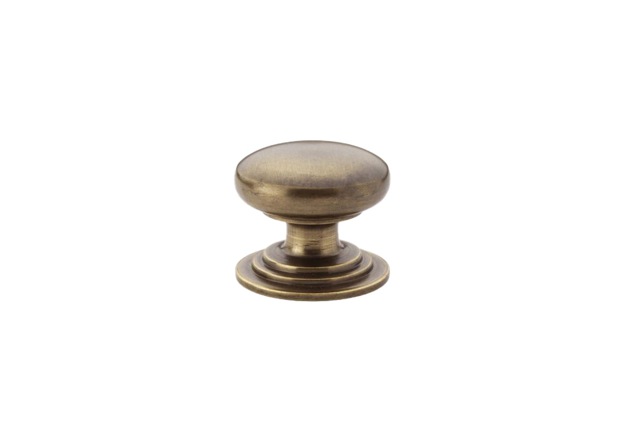 Alexander & Wilks AW825-32-AB Waltz Round Cabinet Knob on stepped rose in antique brass finish, solid brass construction available in 32mm and 38mm sizes for cabinet doors and drawer fronts