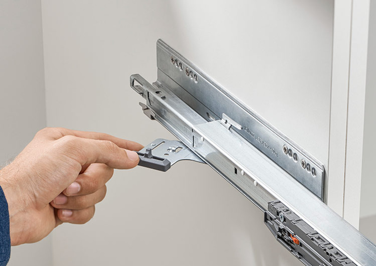 Attaching the secondary TIP-ON BLUMOTION latch component onto a Blum runner during drawer installation