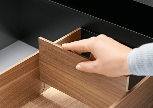 Tool-free installation of Blum AMBIA-LINE Cross Divider with steel spring clips on both ends
