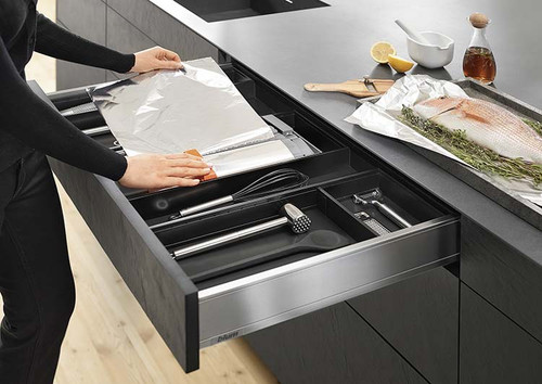 Aluminium foil and cling film dispenser for drawer or worktop use
