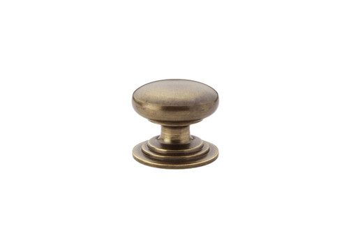 Alexander & Wilks AW825-32-AB Waltz Round Cabinet Knob on stepped rose in antique brass finish, solid brass construction available in 32mm and 38mm sizes for cabinet doors and drawer fronts