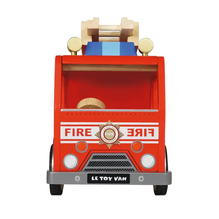 front of wooden fire truck toy by le toy van