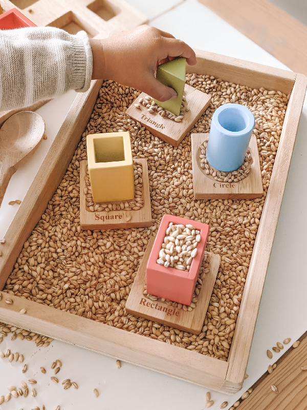sensory play with wooden nesting and sorting board 2