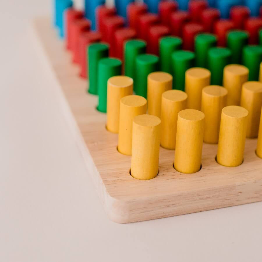 corner of wooden pegboard