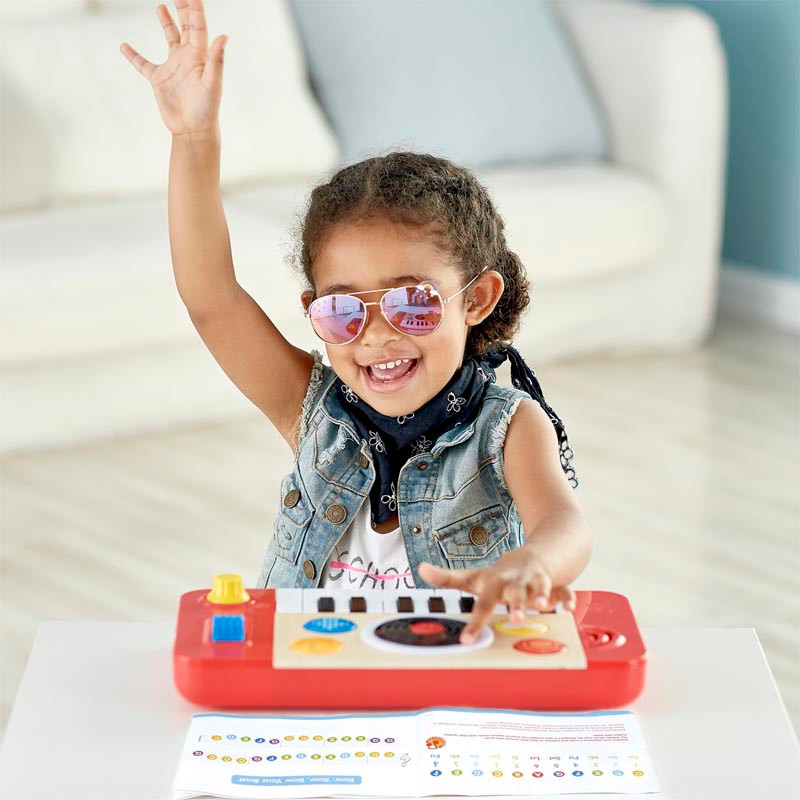 Girl Playing with Hape Electronic Kids Piano DJ Mix &  Studio