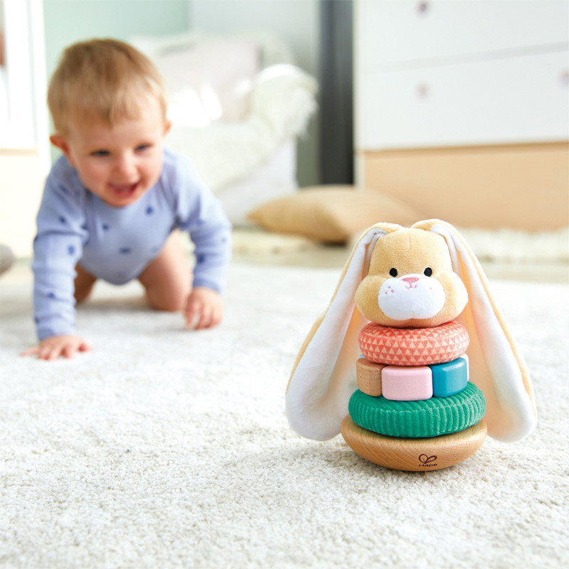 Baby Playing with Hape Bunny Stacker