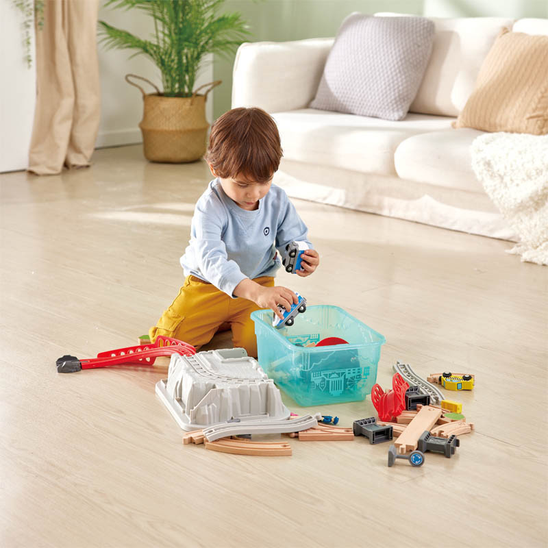 Child Playing with Hape City Train Bucket Set