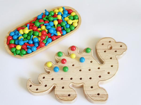 Dinosaur pegboard  with colourful pegs