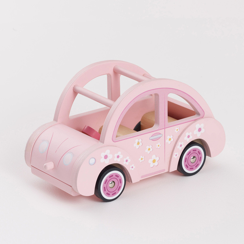 A pretty pink retro style wooden car