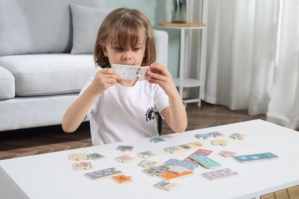 Girl Playing With Number Puzzles