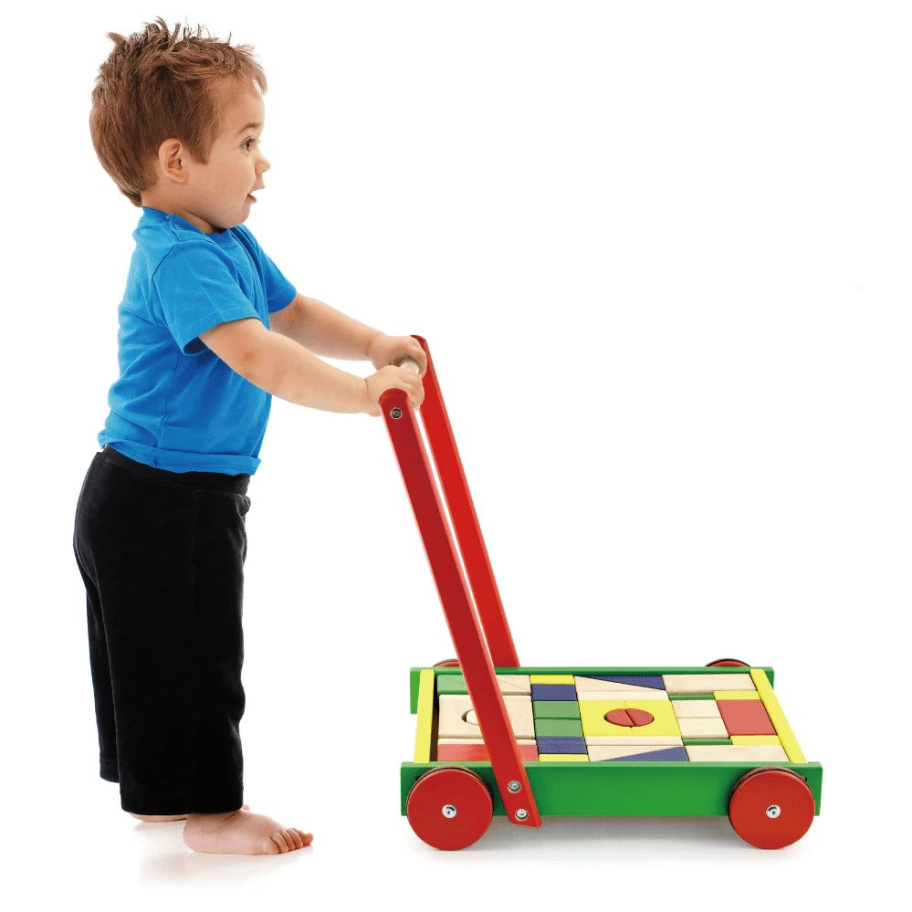 boy pushing viga block wagon