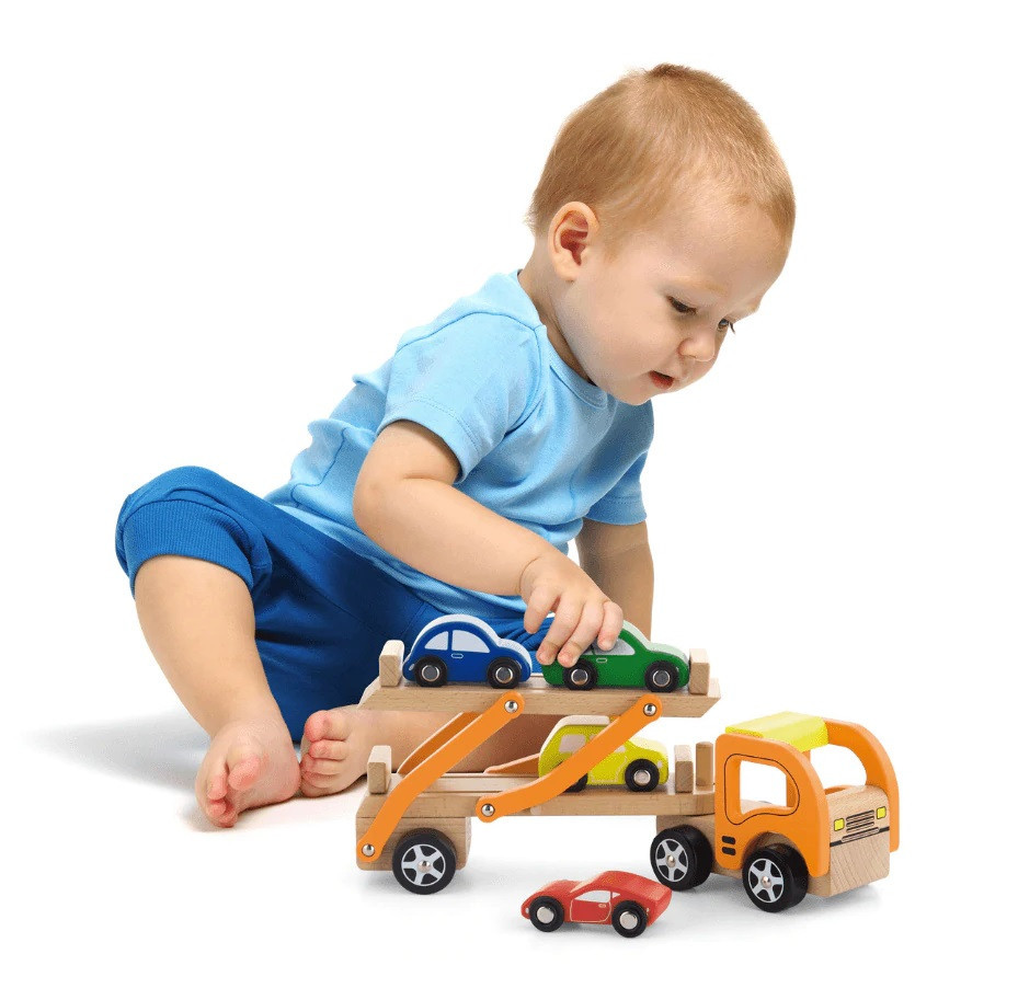 child playing with toy car carrier