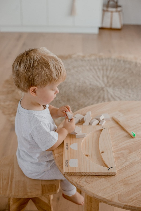 Child playing with Qtoys Teeth Puzzle