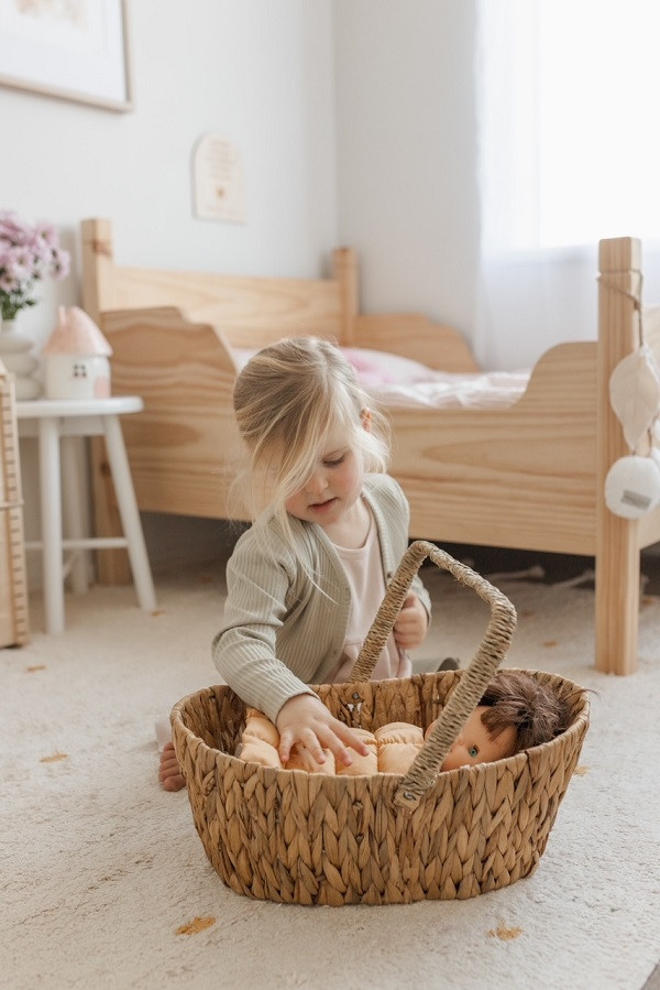 girl playing with Qtoys Wicker Basket