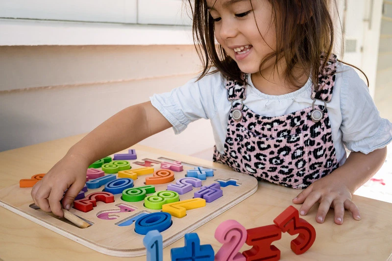 Child playing with Kiddie Connect Take-Along Numbers Puzzle