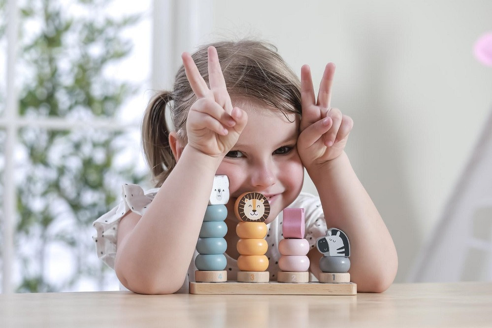 Child playing with Polarb Stacking Blocks