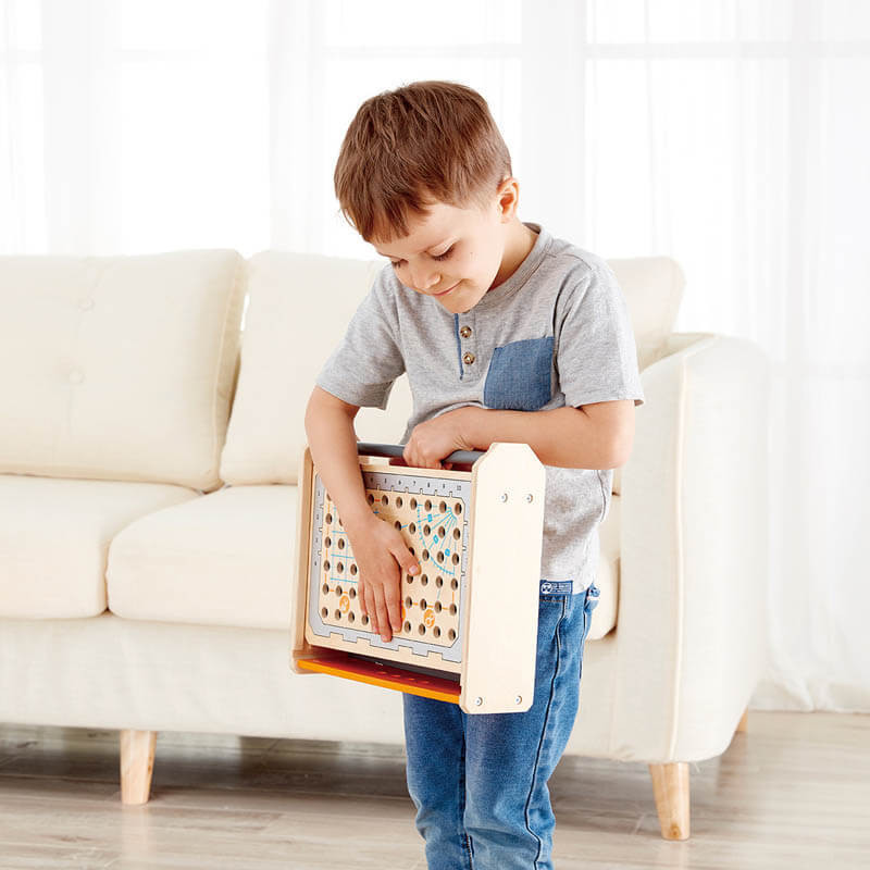 Child carrying Hape Science Experiment Toolbox