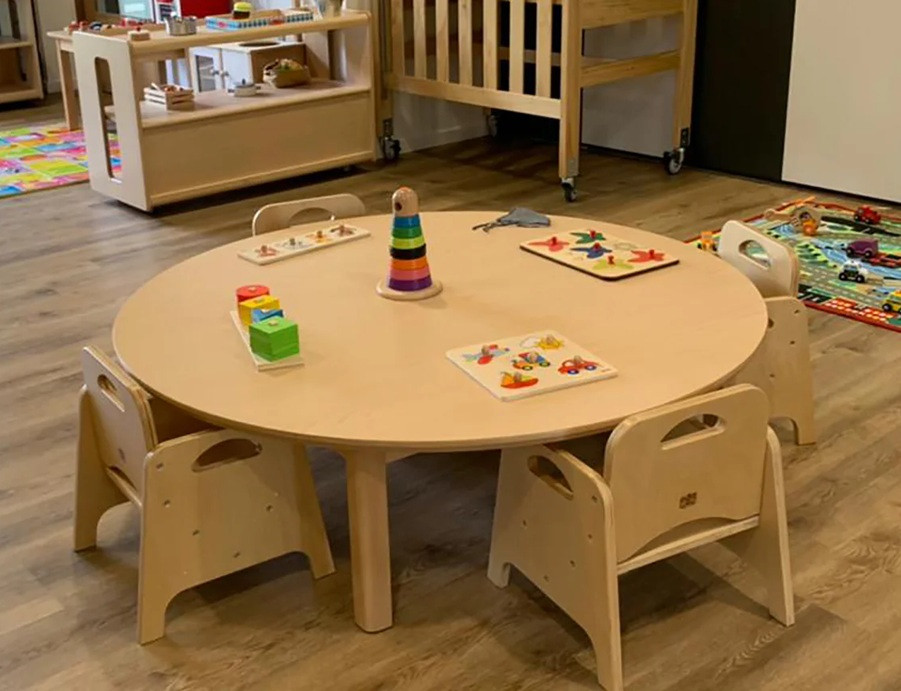 round wooden kids table large in classroom