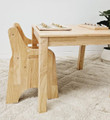 square kids wooden table with toddler chair tucked in
