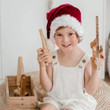 boy playing with qtoys wooden tool set