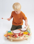 boy playing with tenderleaf musical table