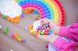 child playing with peg board