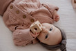 Qtoys Cube Rattle  makes a gentle sound