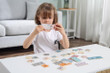 Girl Playing With Number Puzzles