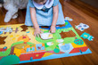 Child playing with Djeco Tactile Farm 12pc Giant Puzzle