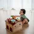 Qtoys Sorting Cottage & Play House with toddler engaged in play