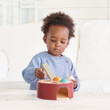 Toddler playing with Tender Leaf Woodpecker Game