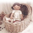 Bonikka Cecilia Linen Doll can still fit in a cradle basket