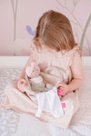 child playing with her bonikka doll set