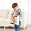 Child carrying Hape Science Experiment Toolbox