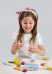 Child playing with Tenderleaf Tropical Fruit Chopping Board