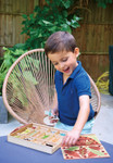 Child enjoying tjhe Tenderleaf My Bug Hotel collection