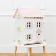 Le Toy Van Daisylane Rose Heart Doll House on top of a table