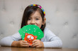 Child making use of Djeco Card Holder