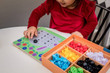 Child playing with Djeco Primo Mosaico Puzzle