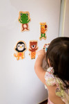 Kid playing with Djeco Wooden Magnetic Jungle Set