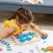 girl playing comparison game