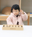 girl playing with edusphere sound balls