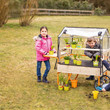 Beleduc Mobile Greenhouse for Kids pushing it along