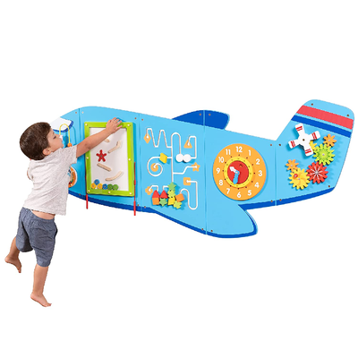 wall toy with boy playing