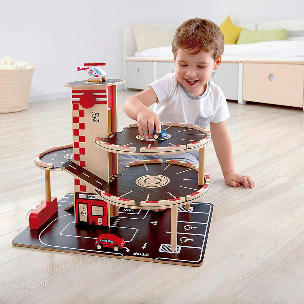 Hape Park N Go Toy Garage  - boy playing
