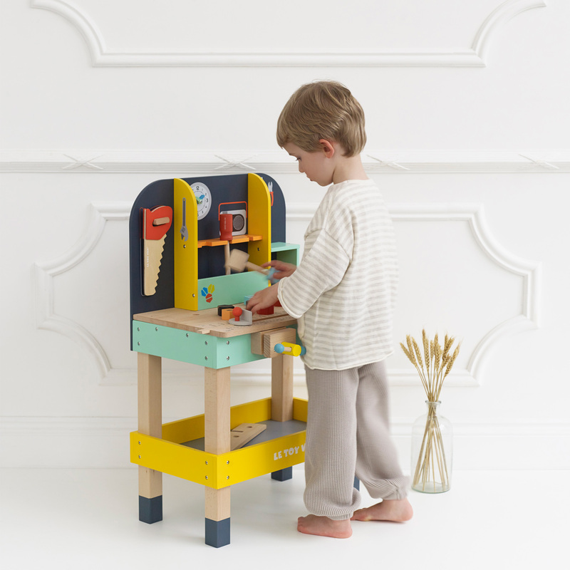 boy playing with workbench