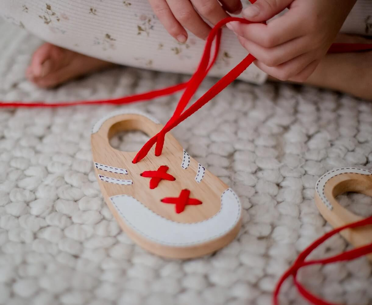 toy wooden lacing shoes