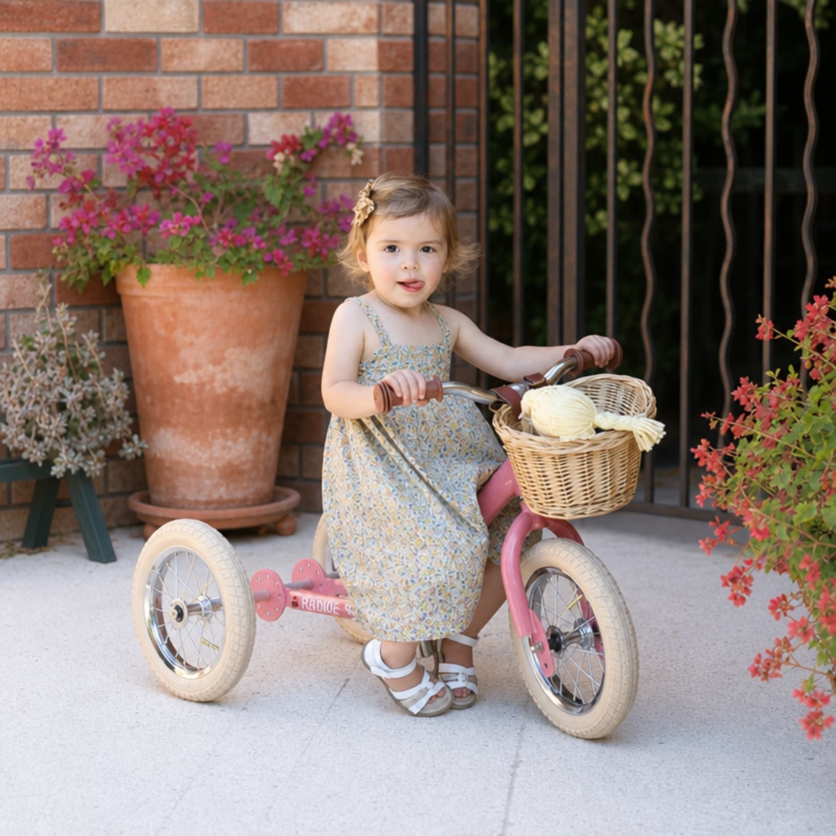 girl on pink vintage trybike